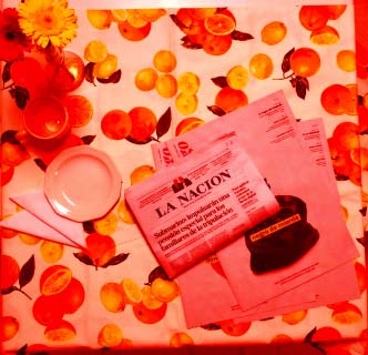 lingo supplement on dinnig table with La Nación diario