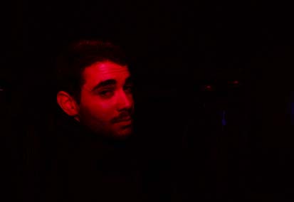 boy looking back from front seat of car